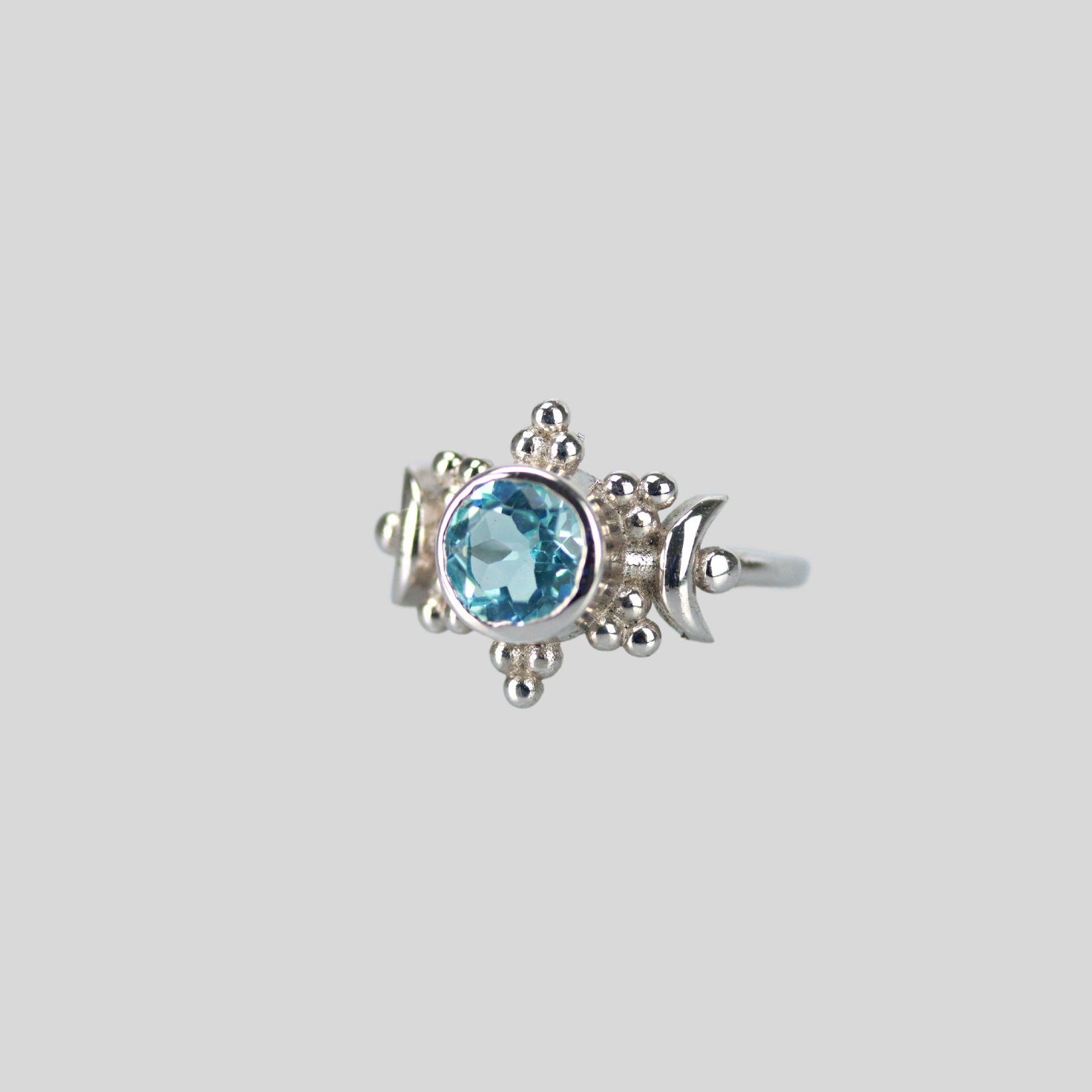 The sun moon ring in blue topaz