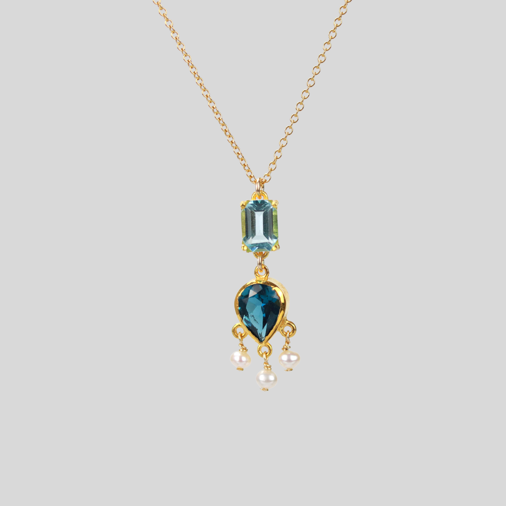 Teardrop and emerald cut blue topaz necklace