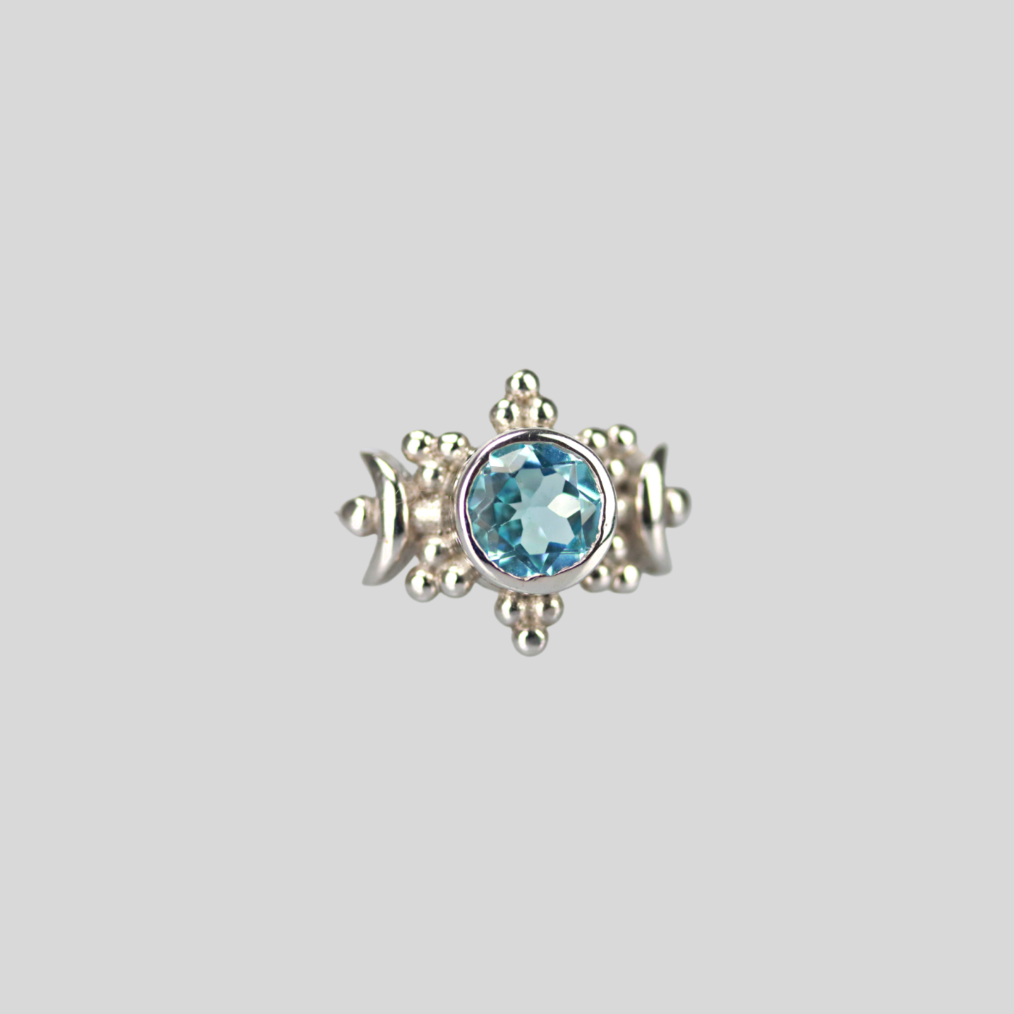 The sun moon ring in blue topaz