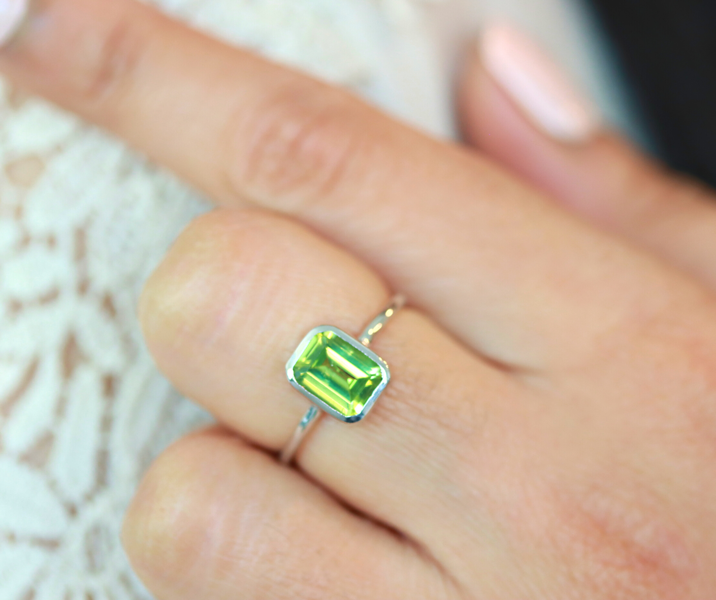 Emerald cut peridot ring