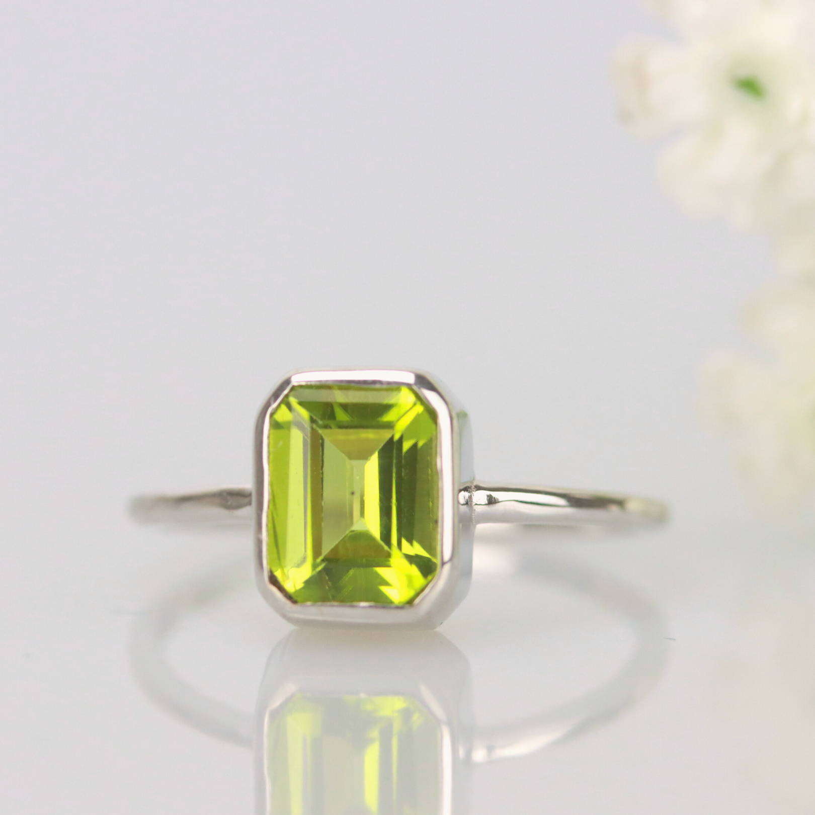 Emerald cut peridot ring