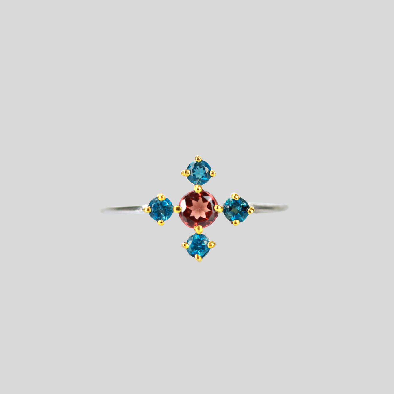 Twinkling flower ring with garnet and london topaz