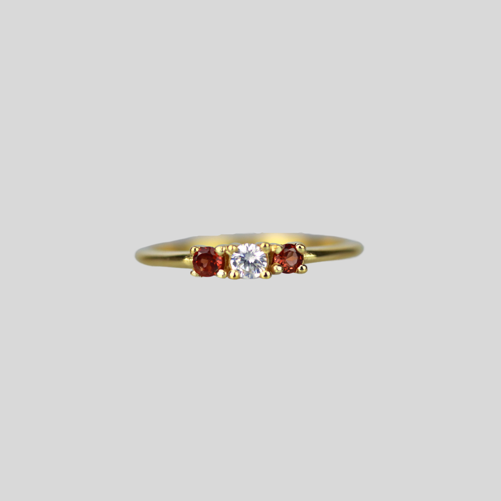 Solid 14k gold triple stone ring in garnet and cubic zirconia