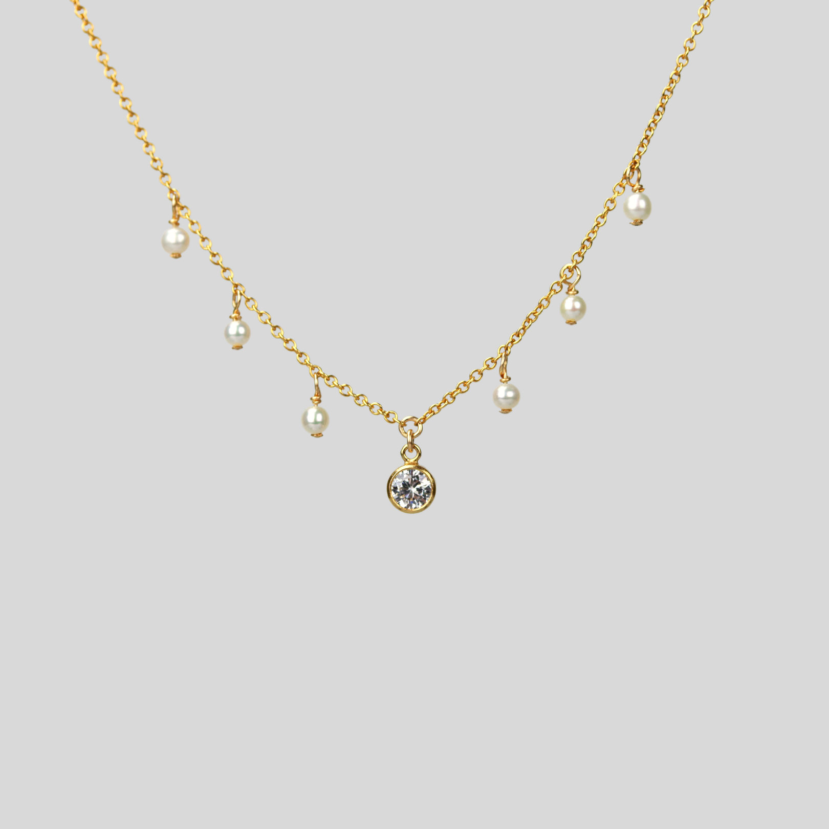 Solitaire and seed pearls necklace