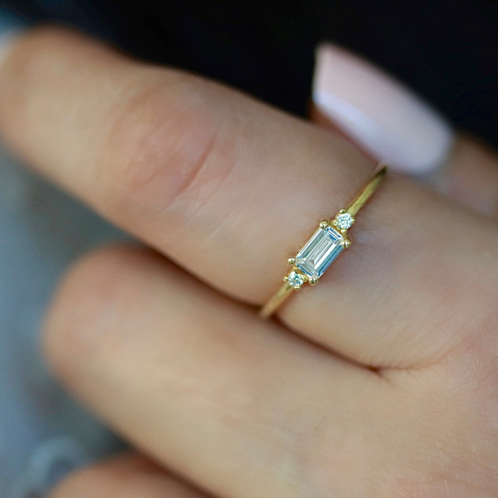 Solid 14k gold ring with east-west emerald cut cz